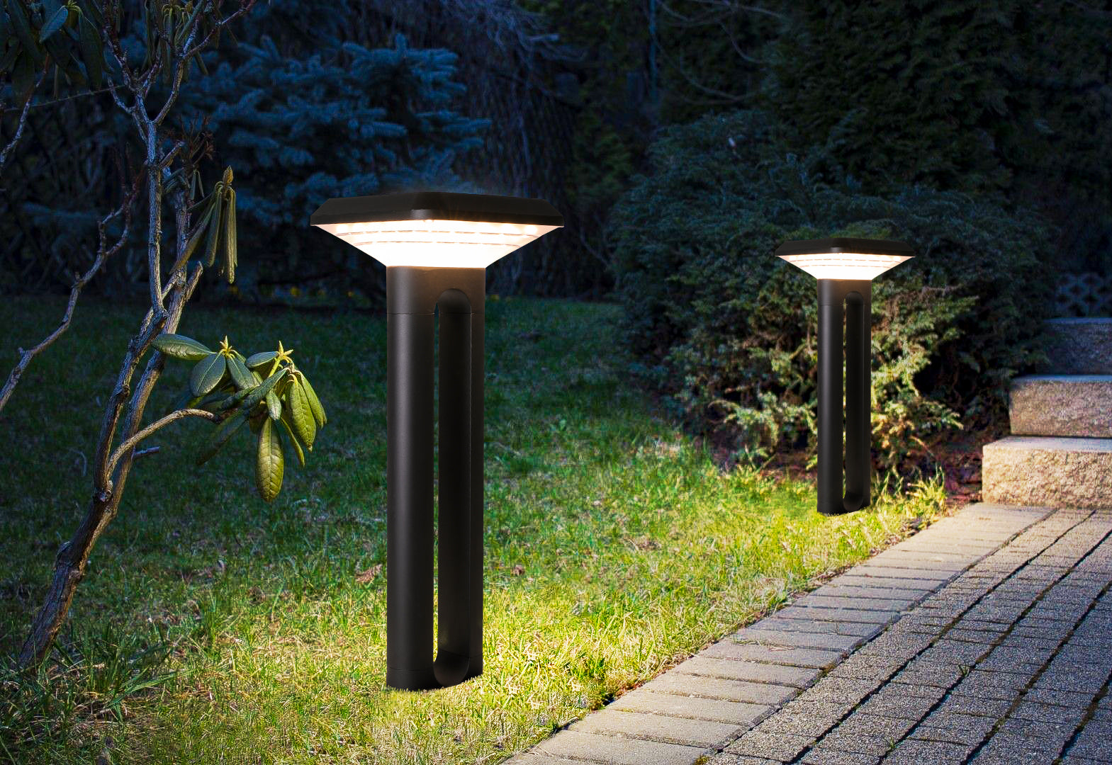 Ark Series Solar Lawn Light CPD1201 illuminating a garden walkway and lawn edge at night