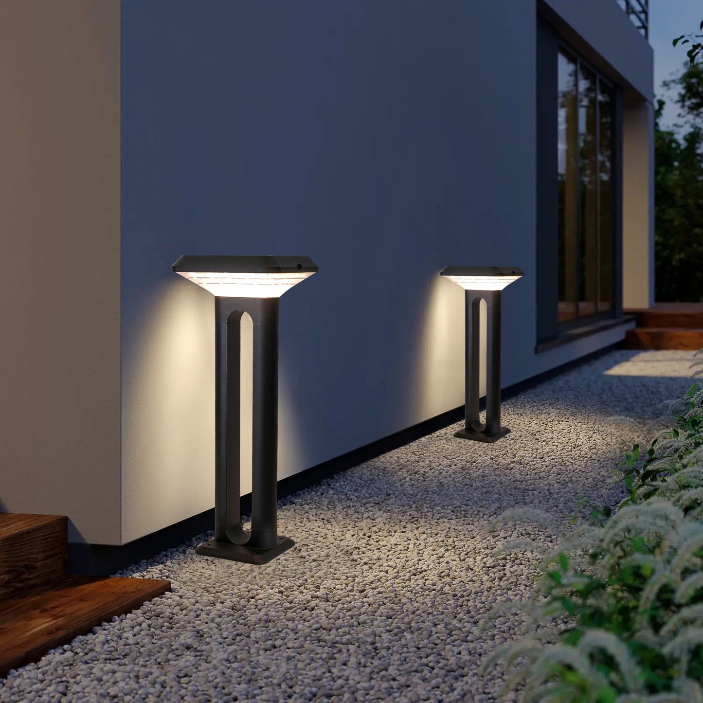 Ark Series Solar Lawn Light CPD1201 installed beside a wall and gravel pathway for warm outdoor lighting