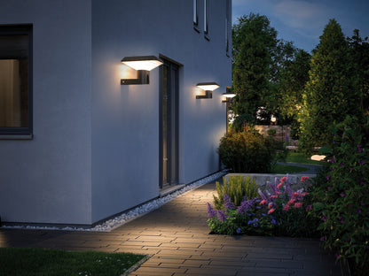 Ark Series Solar Wall Light GT-BD1201 installed along a garden path wall for night lighting