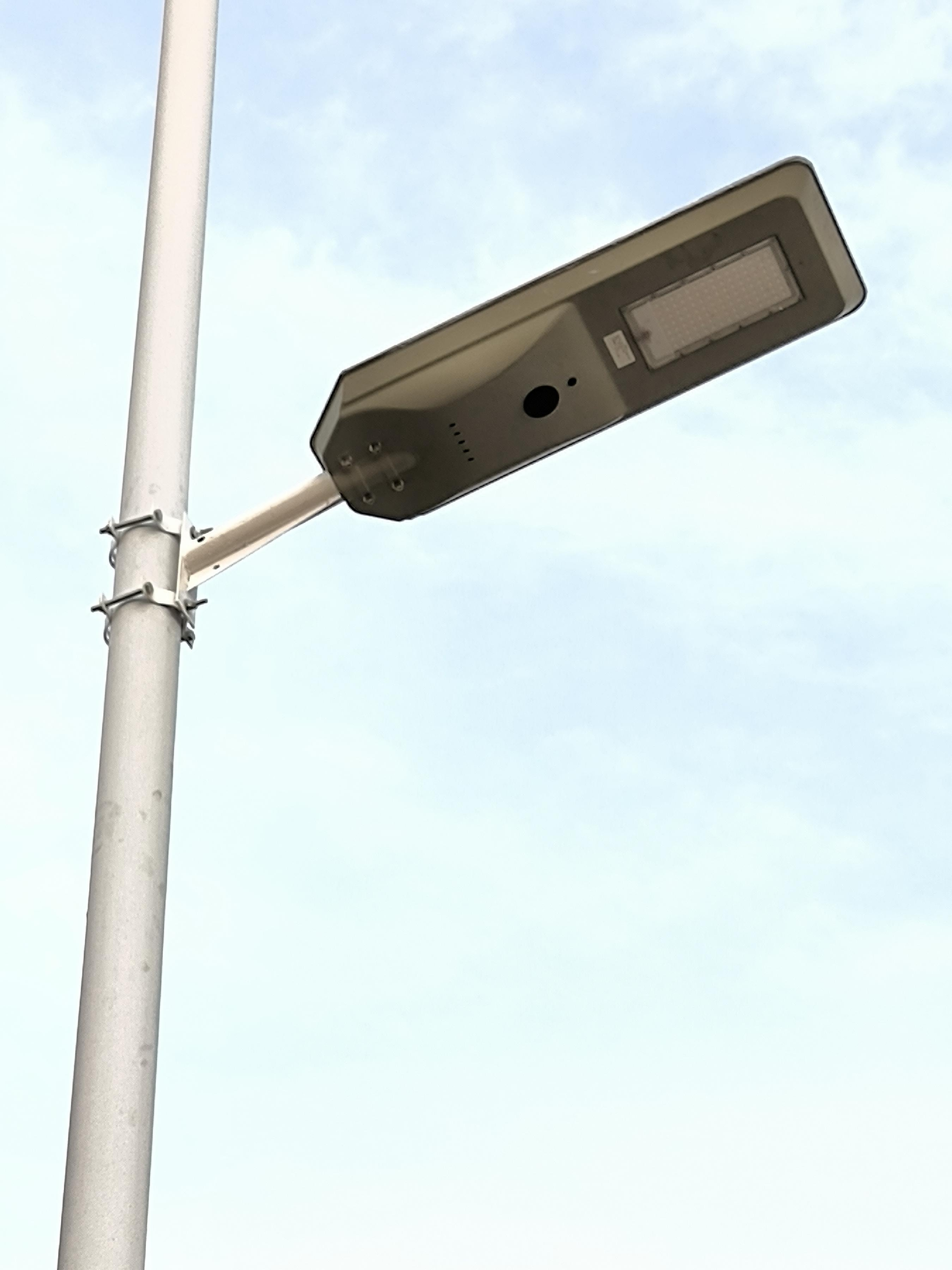 FQ1-B integrated solar street light mounted on pole with adjustable bracket and LED lighting module
