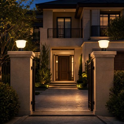 Glass Cup Series solar pillar lights illuminating a villa gate entrance