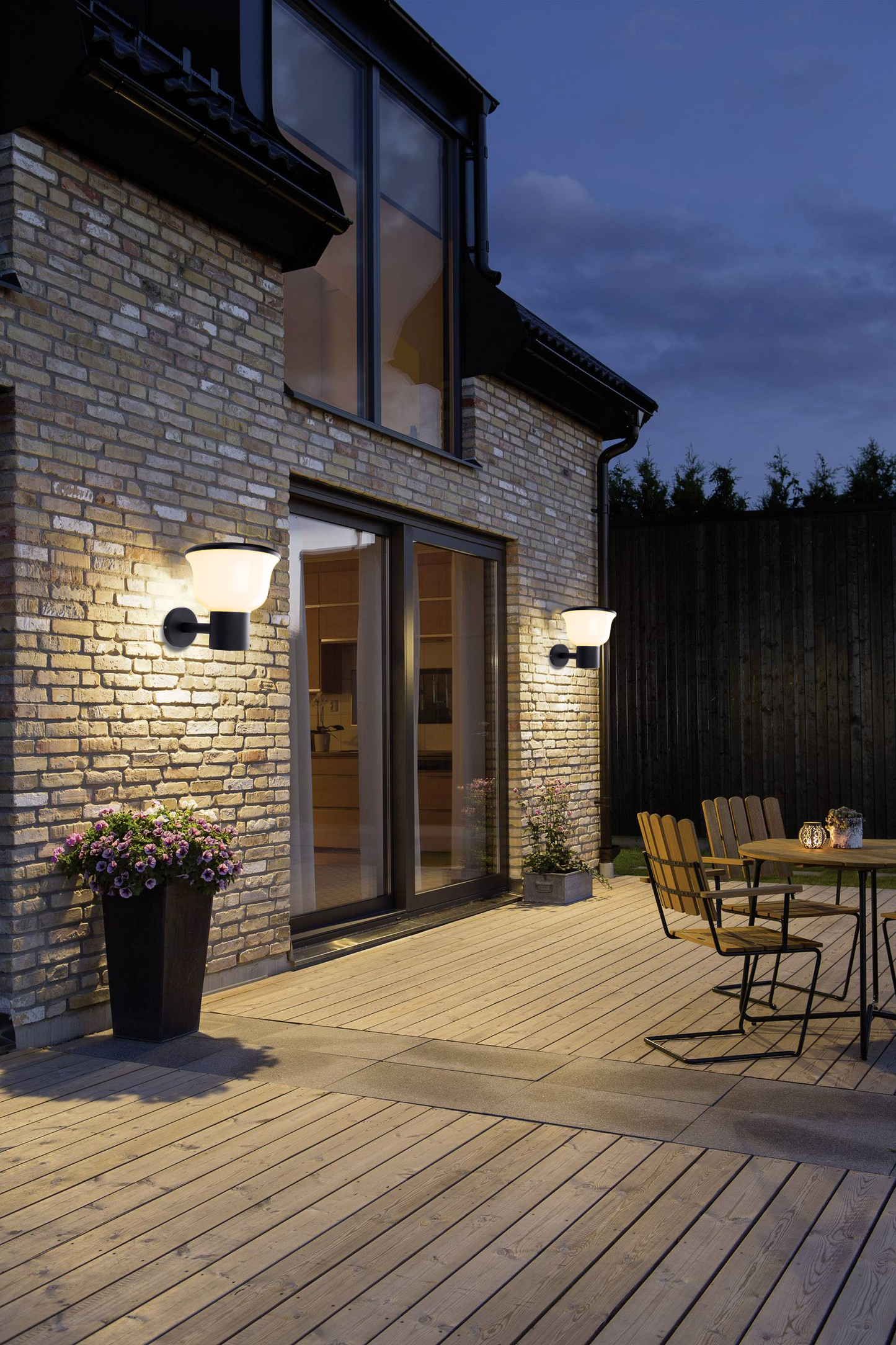 Glass Cup Series Solar Wall Light GT-BD1005 illuminating patio wall and outdoor seating area at night