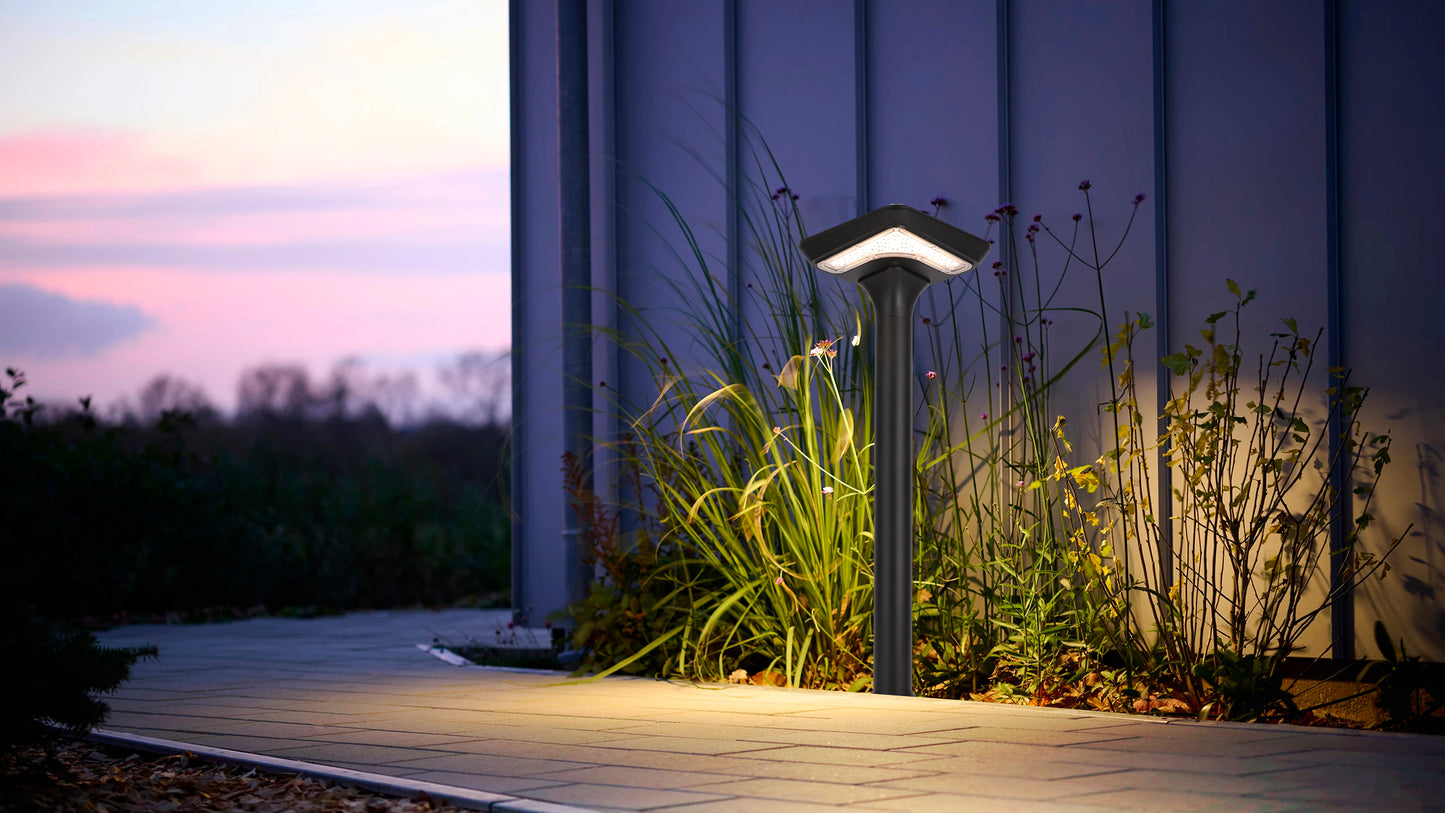 Light Cube Series Solar Lawn Light CPD4003 illuminating a courtyard pathway at dusk