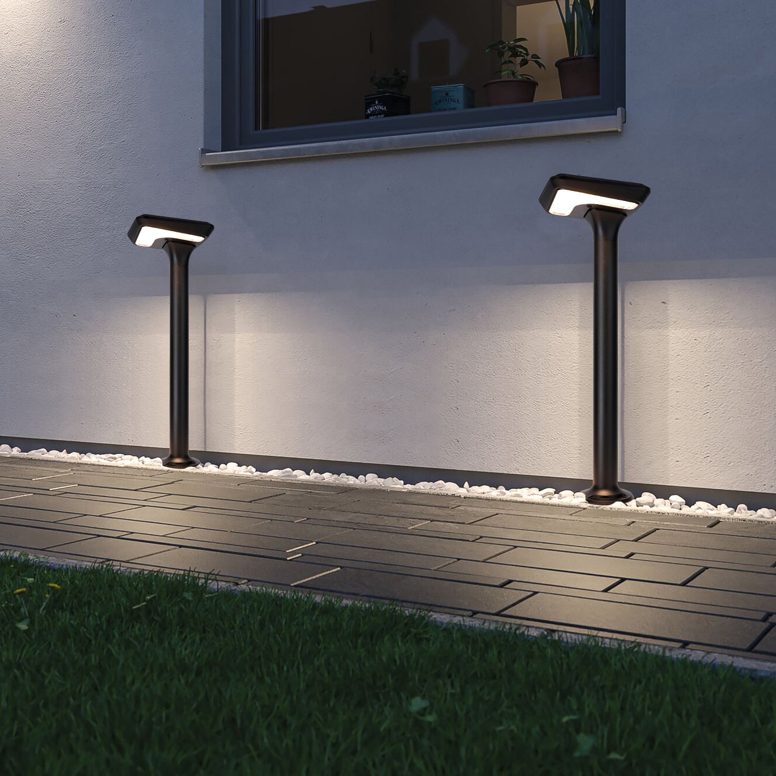 Light Cube Series solar lawn lights installed beside an exterior wall and pathway