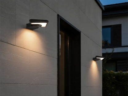 Light Cube Series solar wall light BD4003 installed on a modern exterior wall with warm downward lighting