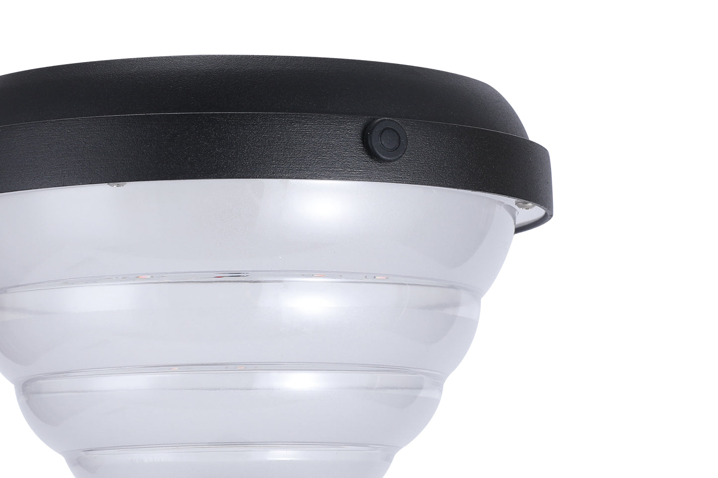 Detail view of the black top cover, switch button, and PC diffuser on CPD1618 solar lawn light