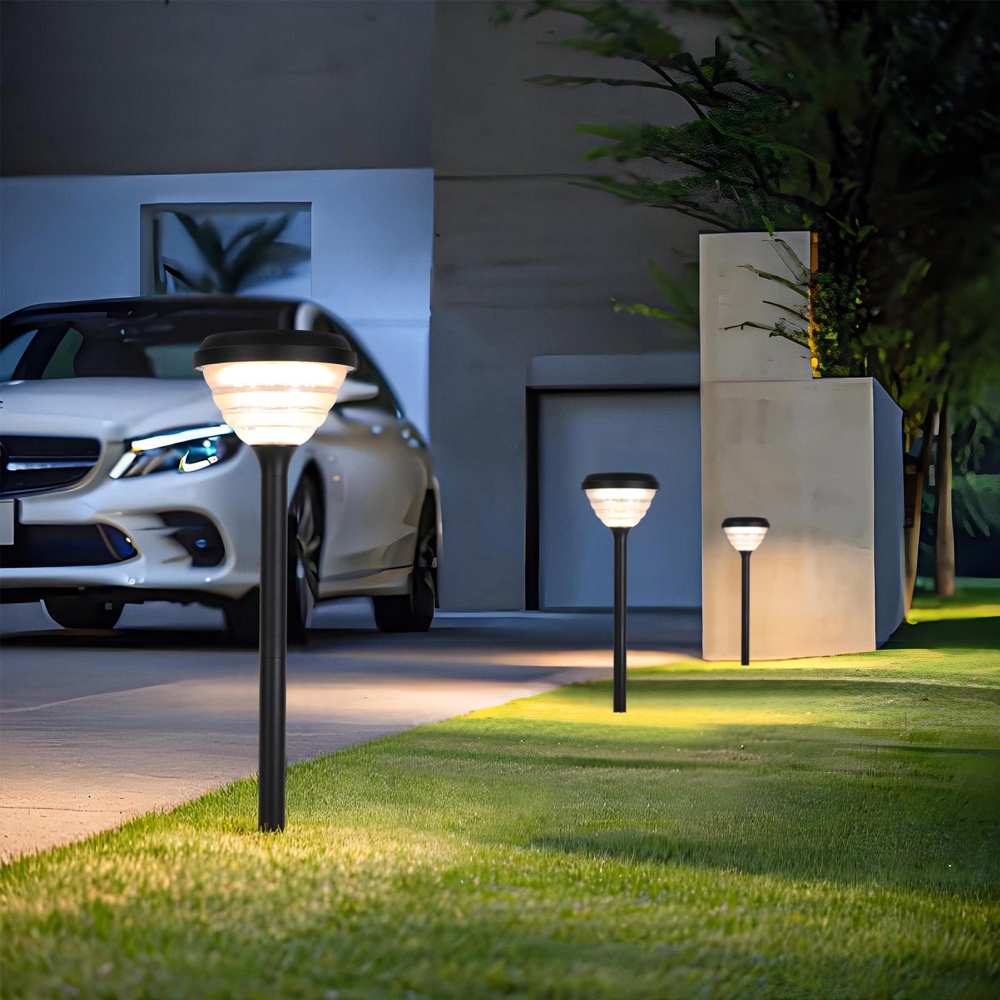 Little Conch Series Solar Lawn Light CPD1618 installed beside a residential driveway lawn