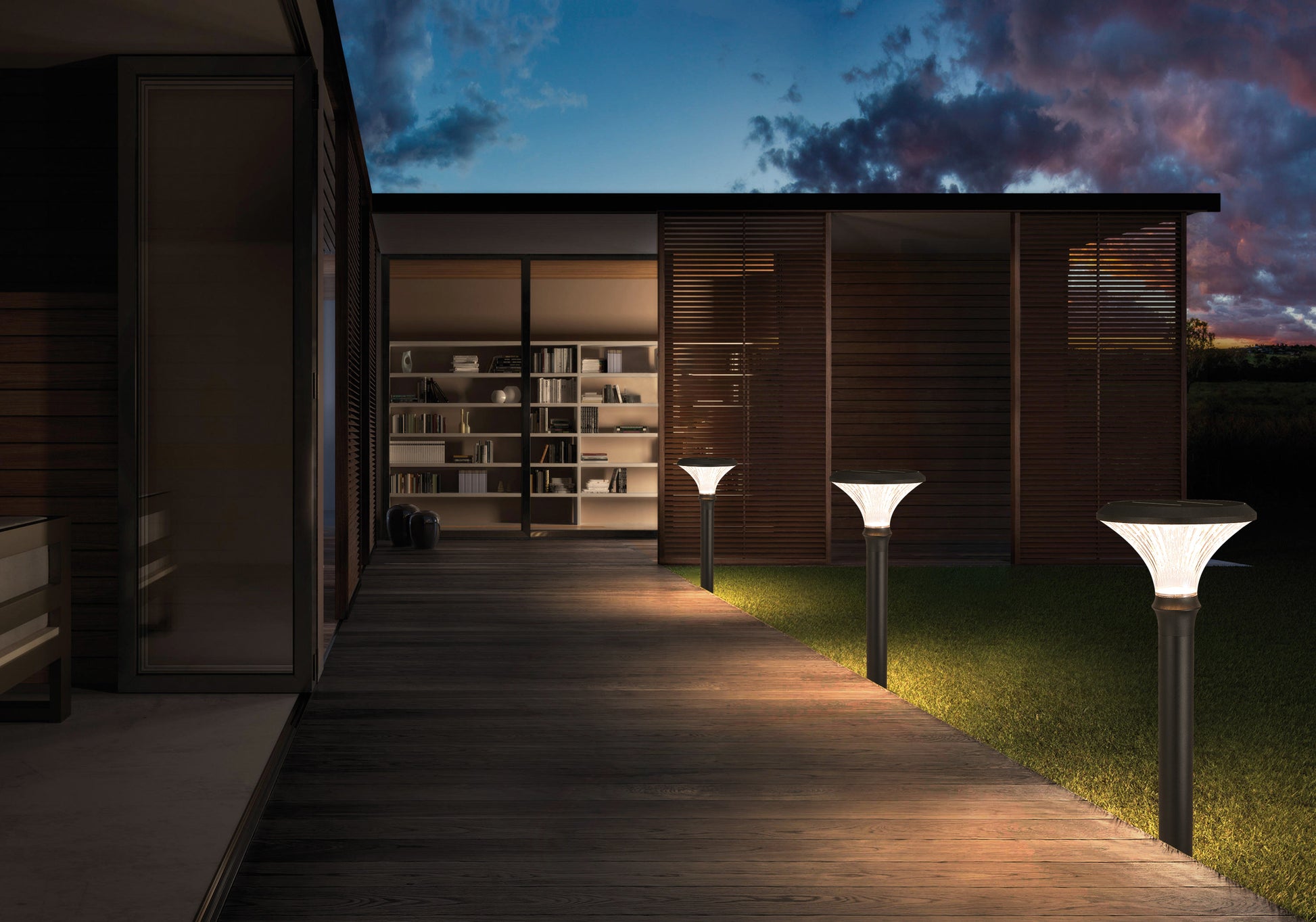 Round Diamond Series solar lawn lights illuminating a modern garden walkway at night