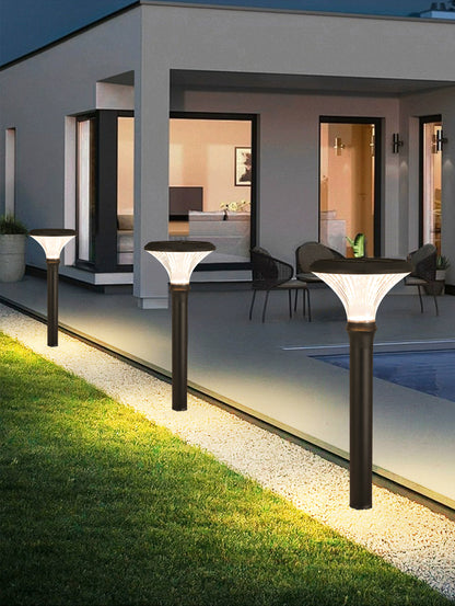 Round Diamond Series Solar Lawn Light CPD3002 installed outside a modern home landscape