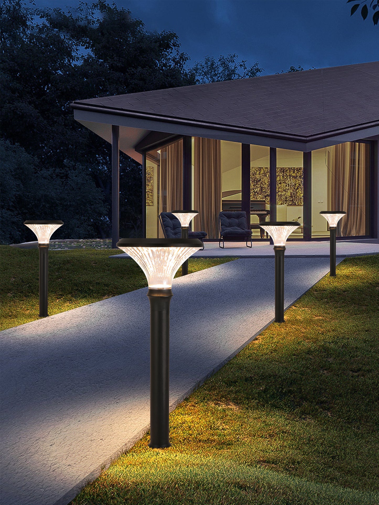 Round Diamond Series solar lawn lights installed along a villa pathway for soft outdoor lighting