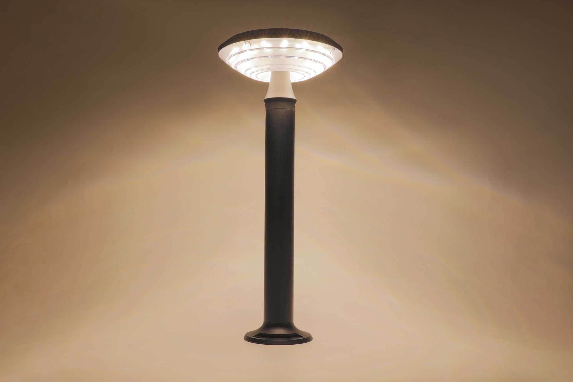 Round Moon Series Solar Lawn Light CPD3202 showing warm lighting effect indoors