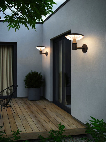 Round Moon Series solar wall lights BD3202 installed near exterior doors for decorative outdoor lighting